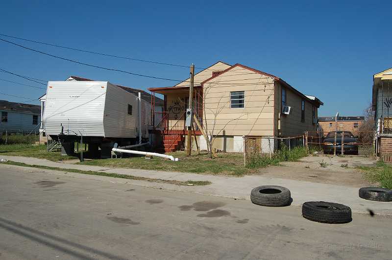 New Orleans 04-08-06 092.JPG - Some people are fortunate enough to have access to a trailer while repairing their homes.  It appears that the trailer was temporarlily connected to the power grid (I couldn't tell if power was on).  Other trailers were powered by generator.